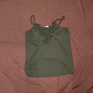 green tank-top with florals on it